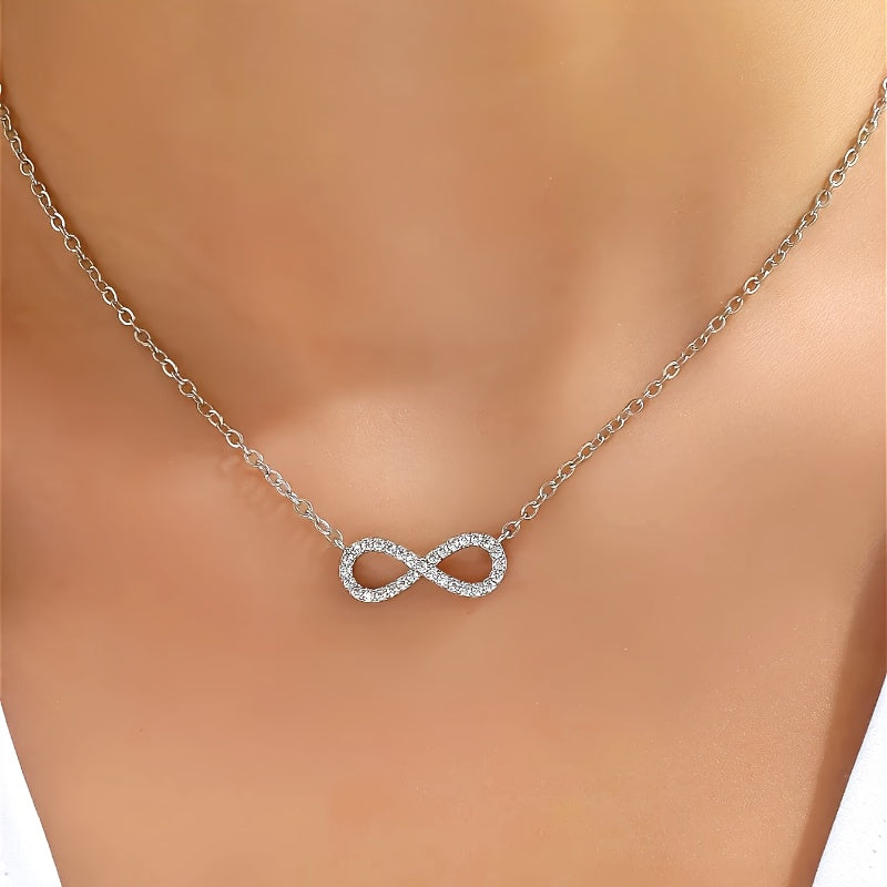White gold necklace with an infinity pendant and zirconia cubic stones.