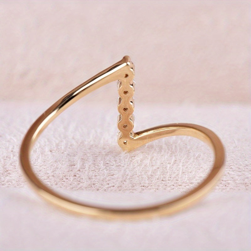 Thin white gold ring with Z-shaped cubic zirconia