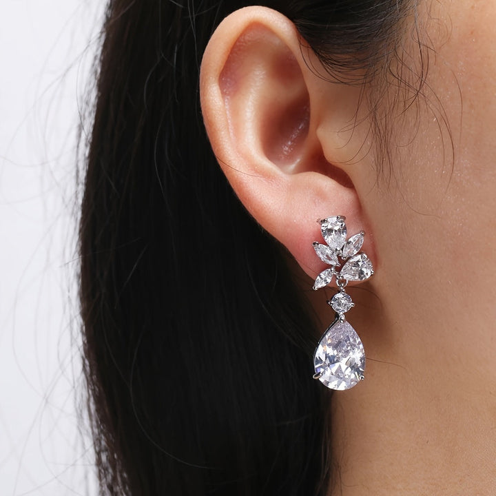 Drop earrings with flowers in white gold