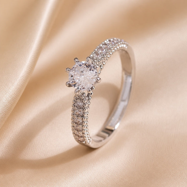 Essential white gold ring with embedded cubic zirconia