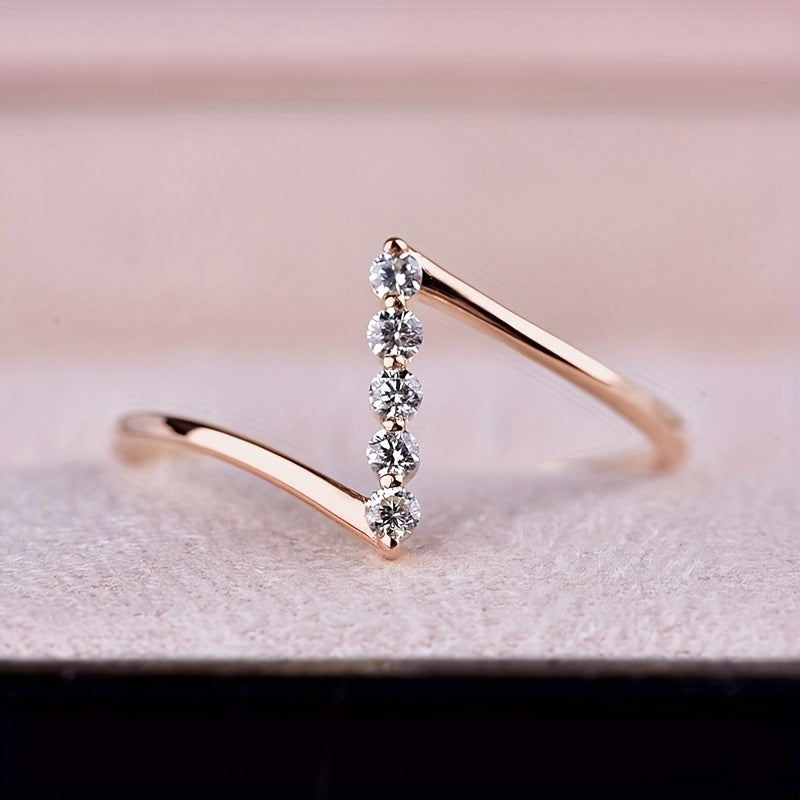 Thin white gold ring with Z-shaped cubic zirconia
