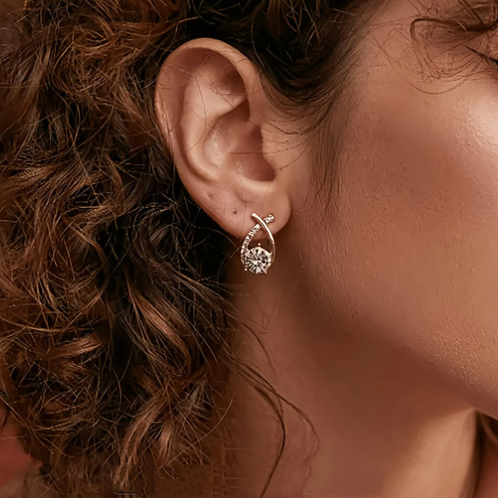 Earrings with golden cross and zirconia
