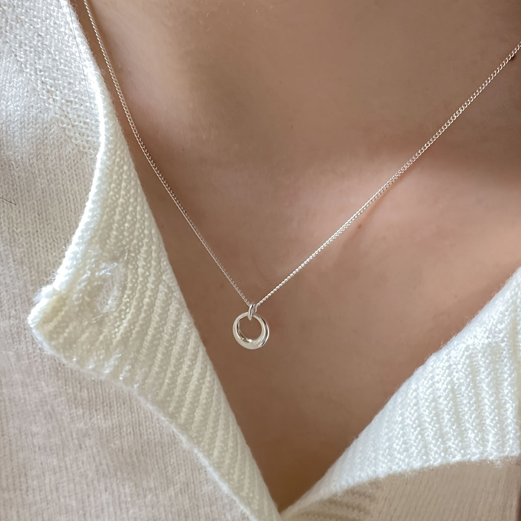 White gold necklace with circular geometric pendant