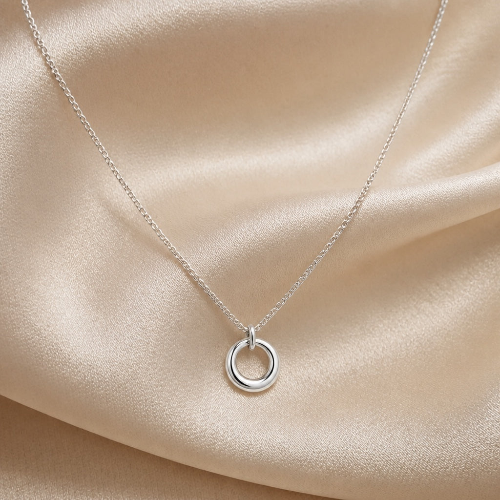 White gold necklace with circular geometric pendant