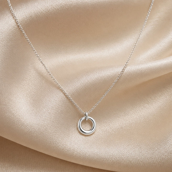 White gold necklace with circular geometric pendant