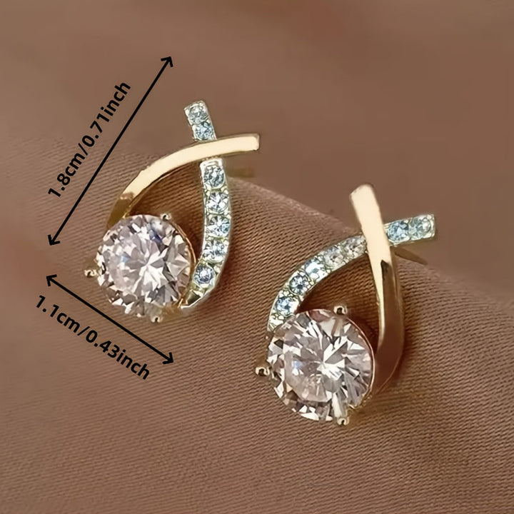Earrings with golden cross and zirconia