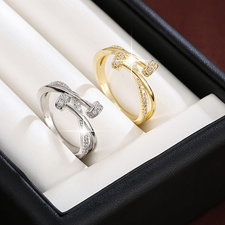 Crossed white gold ring with cubic zirconia