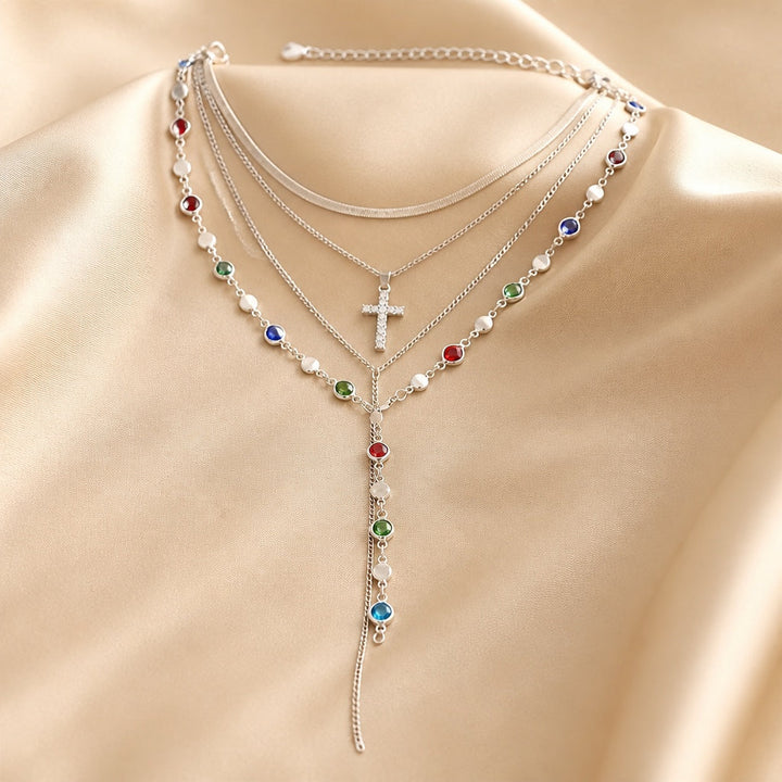 White gold necklace and earrings set with multicolored gemstones