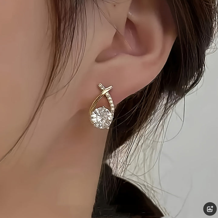Earrings with golden cross and zirconia