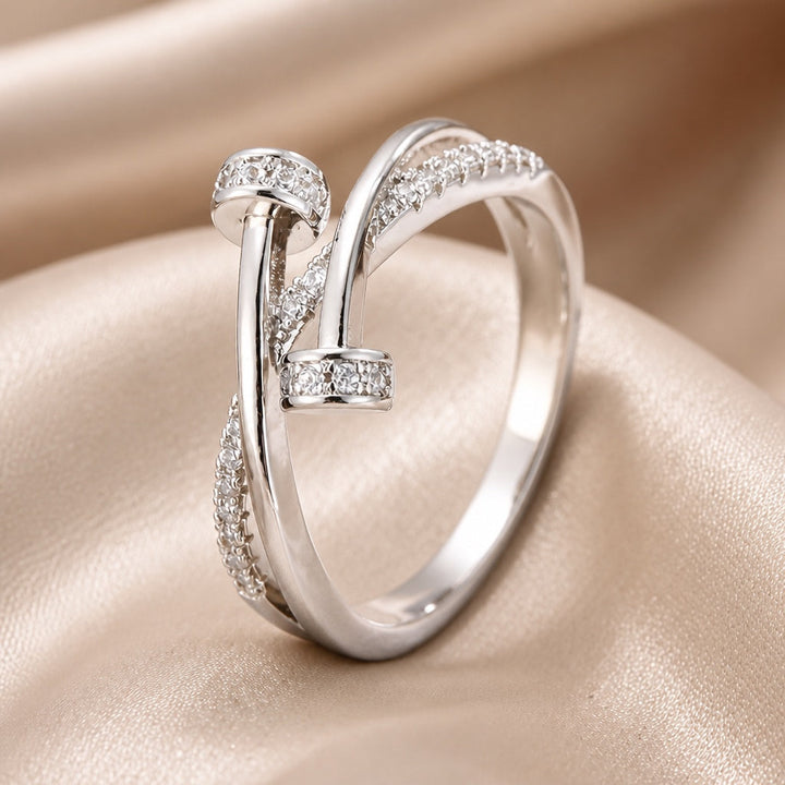 Crossed white gold ring with cubic zirconia