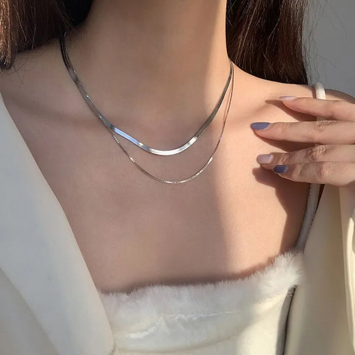 Layered necklace with white gold snakes