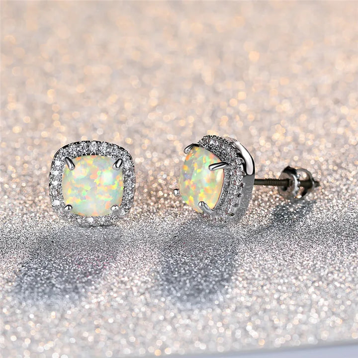 Elegant silver earrings with round white fire opals