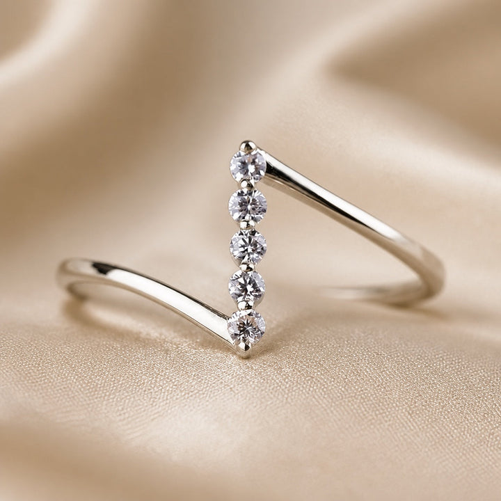 Thin white gold ring with Z-shaped cubic zirconia
