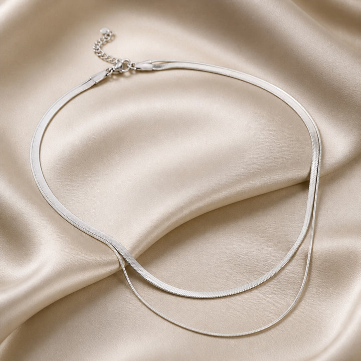 Layered necklace with white gold snakes
