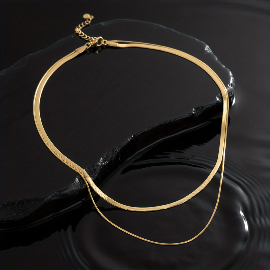 Layered necklace with white gold snakes