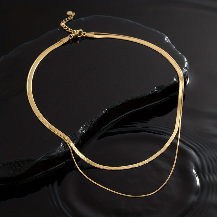 Layered necklace with white gold snakes