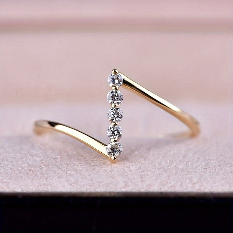 Thin white gold ring with Z-shaped cubic zirconia