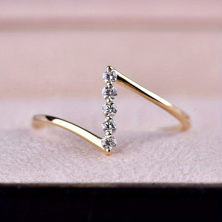 Thin white gold ring with Z-shaped cubic zirconia