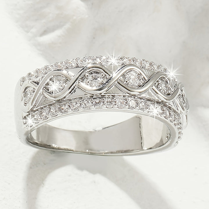 White gold ring with a double row of cubic zirconia gemstones